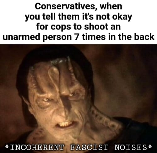 This meme is a photo of a person with a gruesome, zombie-like face, with a caption that reads: "Conservatives, when you tell them it's not okay for cops to shoot an unarmed person 7 times in the back". The image is a humorous and satirical take on the way some conservatives react to issues of police brutality and racial injustice.